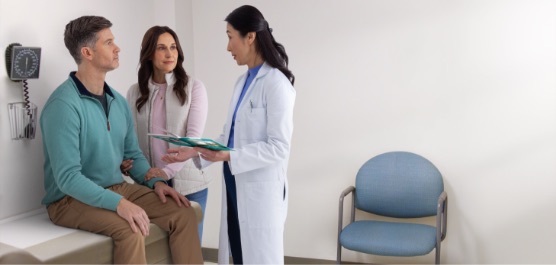 Actor portrayal of an HD patient and their caregiver having a productive conversation with a doctor