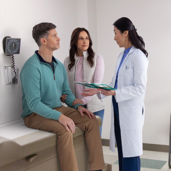 Actor portrayal of an HD patient and their caregiver having a productive conversation with a doctor